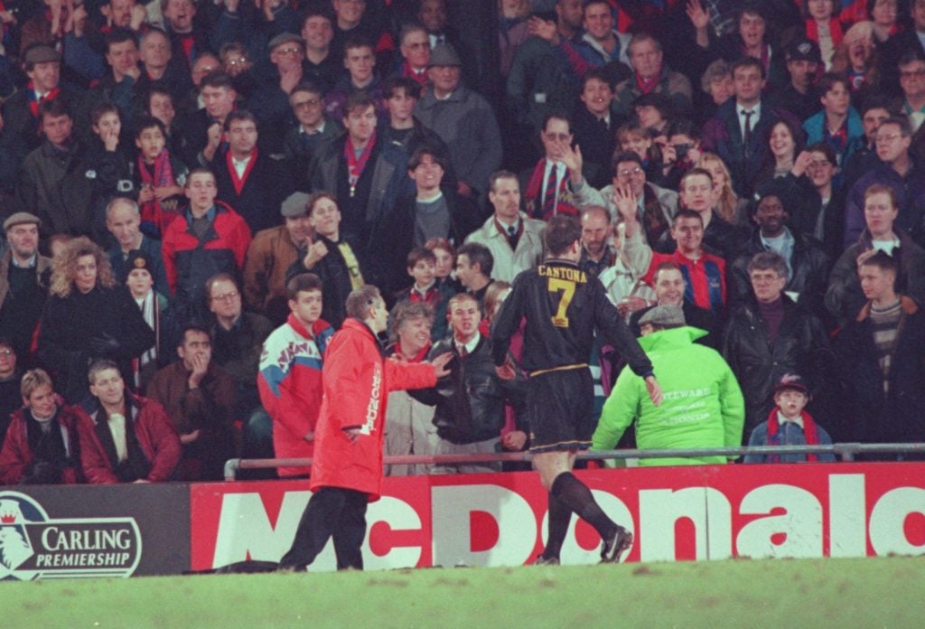 ERIC CANTONA OF MANCHESTER UNITED IS INVOLVED IN A FIGHT WITH A FAN AFTER HE WAS SENT OFF DURING THE CRYSTAL PALACE V MANCHESTER UNITED MATCH AT SE...