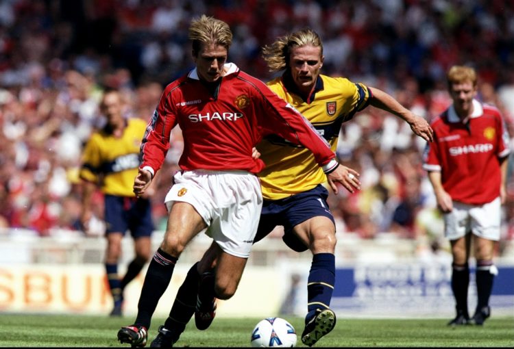 9 Aug 1998:  David Beckham of Manchester United being challanged by Emmanuel Petit of Arsenal during the FA Charity Shield match at Wembley Stadium...