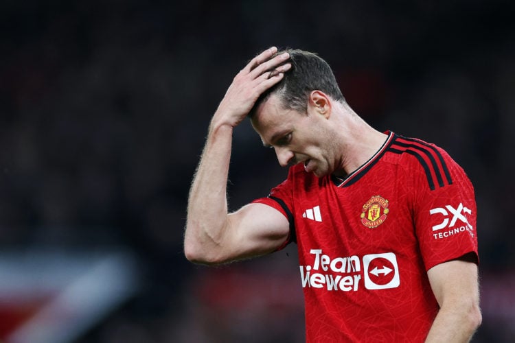 Jonny Evans of Manchester United looks dejected after Erling Haaland of Manchester City scores his team's second goal during the Premier League mat...