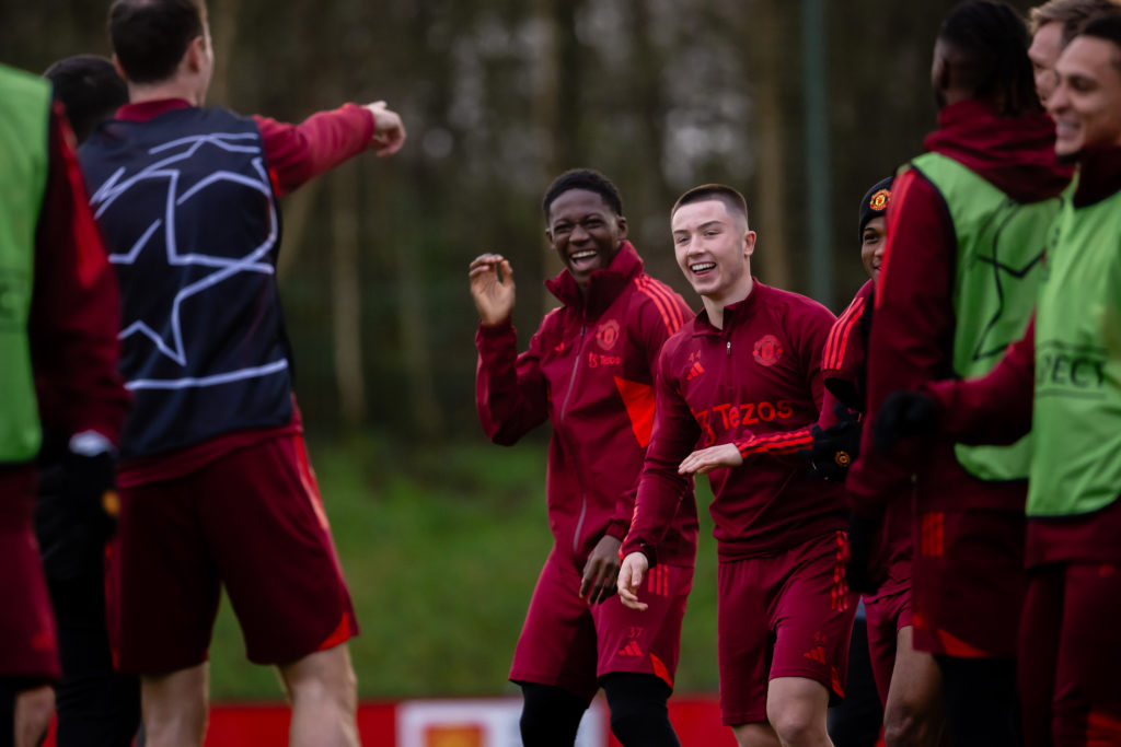 Amad, Dan Gore and Kobbie Mainoo of Manchester United in action during a first team training session at Carrington Training Ground on December 11, ...
