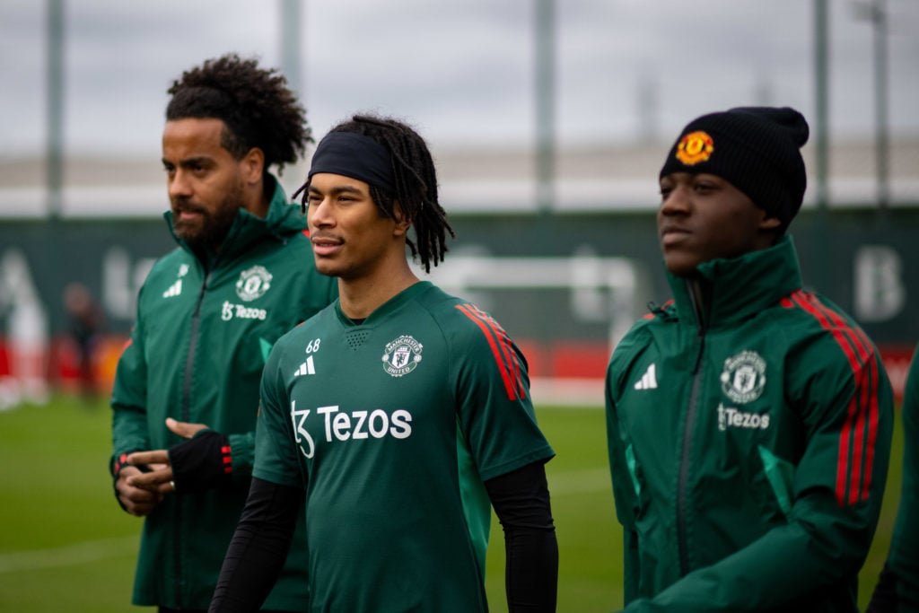 (EXCLUSIVE COVERAGE)  Maxi Oyedele, Kobbie Mainoo of Manchester United in action during a first team training session at Carrington Training Ground...