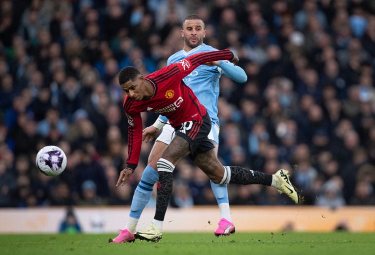 Marcus Rashford of Manchester United is challenged by Kyle Walker of Manchester City during the Premier League match between Manchester City and Ma...