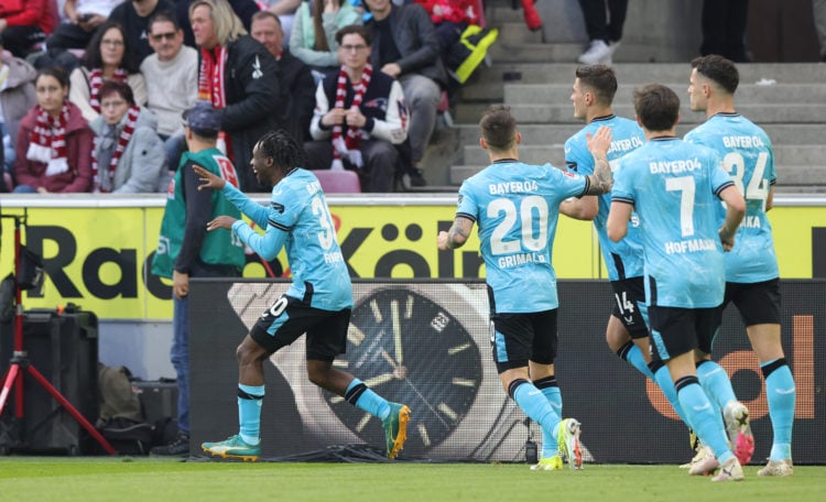 Jeremie Frimpong of Bayer 04 Leverkusen (L) celebrates with teammates after scoring his teams first goal during the Bundesliga match between 1. FC ...