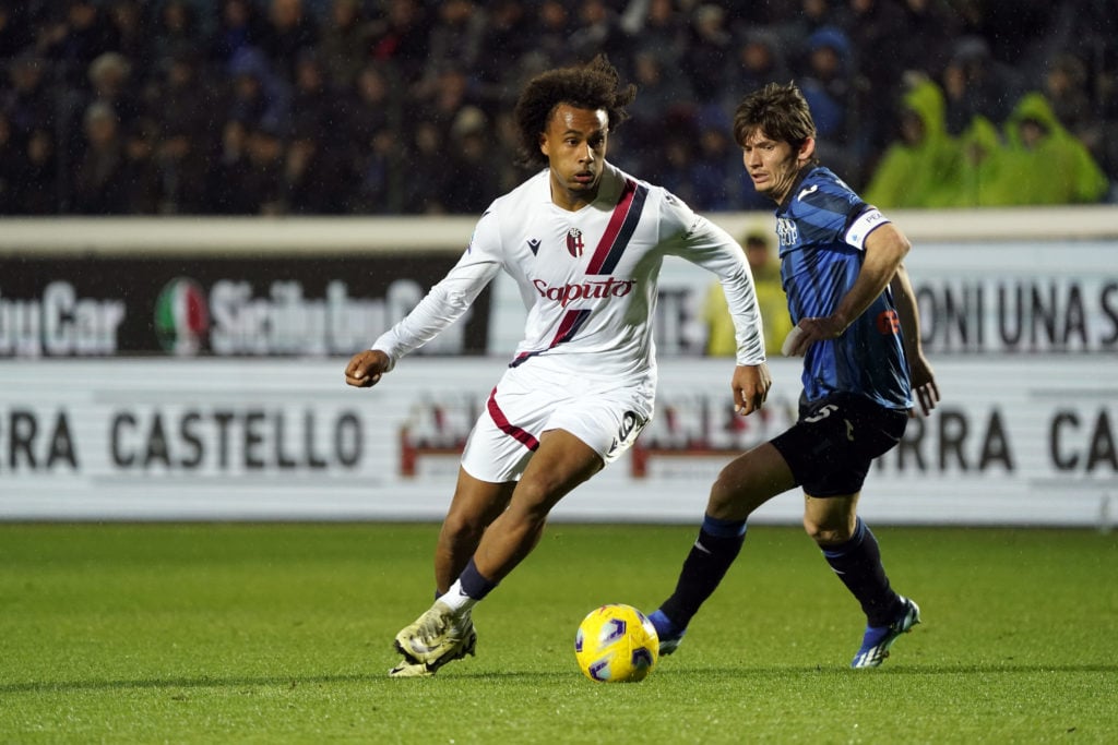 Joshua Zirkzee of Bologna FC competes for the ball with Marten de Roon of Atalanta BC during the Serie A TIM match between Atalanta BC and Bologna ...