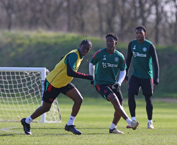 Bendito Mantato, Kobbie Mainoo and Willy Kambwala of Manchester United in action during a first team training session at Carrington Training Ground...