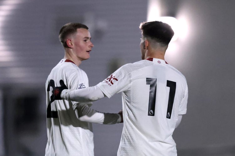 Ashton Missin of Manchester United U21 celebrates scoring his team's first goal with teammate Harry Amass during the Premier League 2 match between...