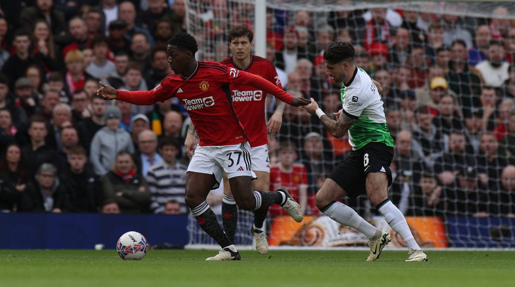 Kobbie Mainoo of Manchester United in action with Dominik Szoboszlai  of Liverpool during the Emirates FA Cup Quarter Final match between Mancheste...