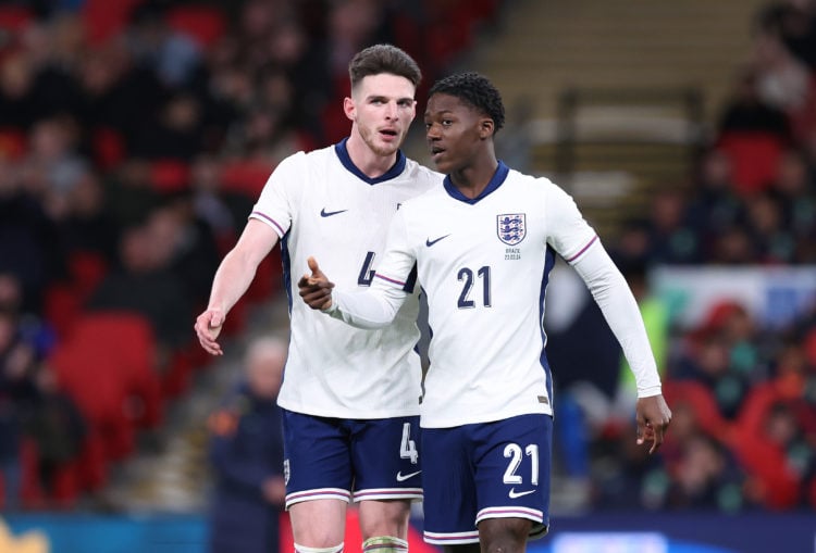 Declan Rice of England talks with Kobbie Mainoo during the international friendly match between England and Brazil at Wembley Stadium on March 23, ...