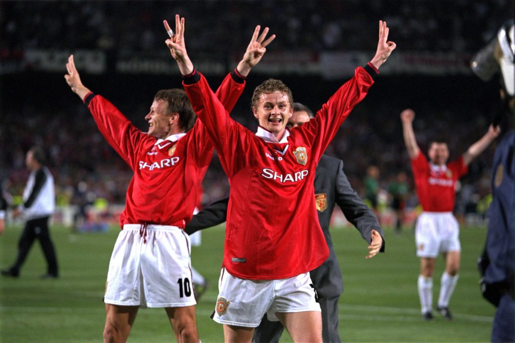 Match goalscorers Teddy Sheringham and Ole Gunnar Solskjaer of Manchester United celebrate with a treble salute after the UEFA Champions League Fin...