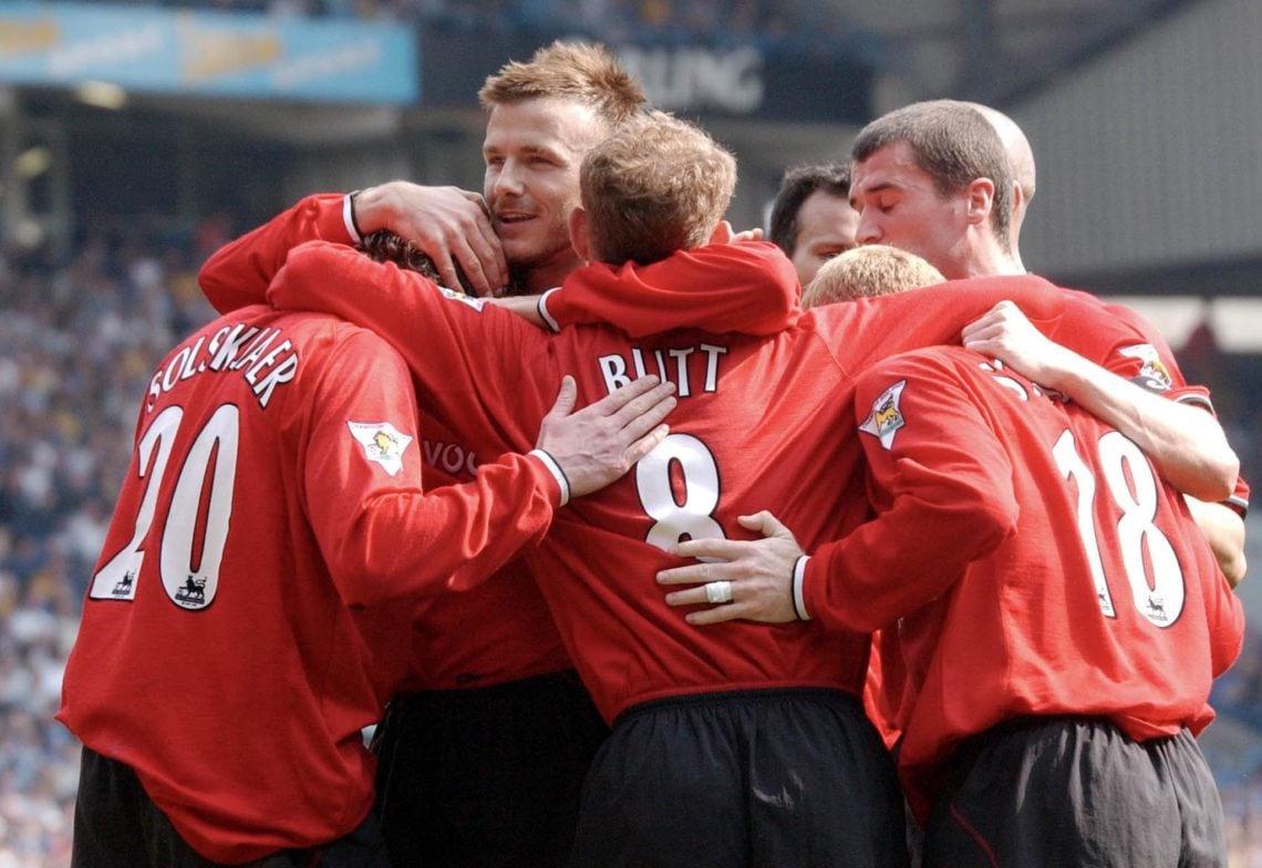 Manchester United player David Beckham (2nd L) and teammates hug Ole Gunnar Solskjaer (L) after he scored a goal against Leeds during their premier...