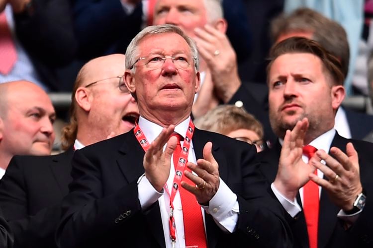 Manchester United's former manager Alex Ferguson watches from the crowd ahead of the kick off of the English FA Cup semi-final football match betwe...