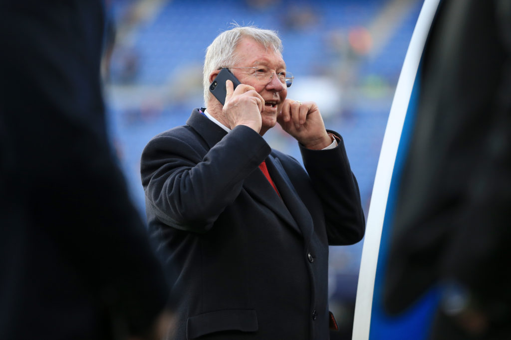 Former Man Utd manager Sir Alex Ferguson speaks on his mobile phone before the UEFA Champions League Quarter Final second leg match between FC Barc...