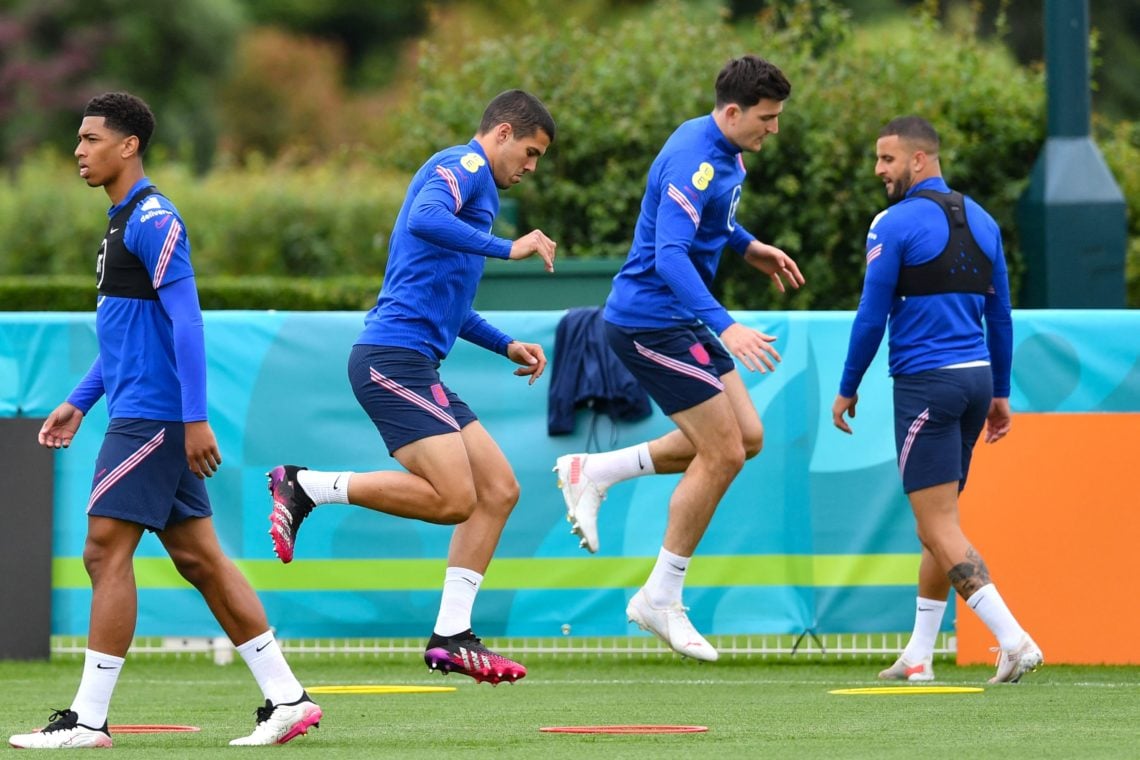 England's defender Conor Coady (2L) and England's defender Harry Maguire (2R) take part in a training session at the Tottenham Hotspur training gro...