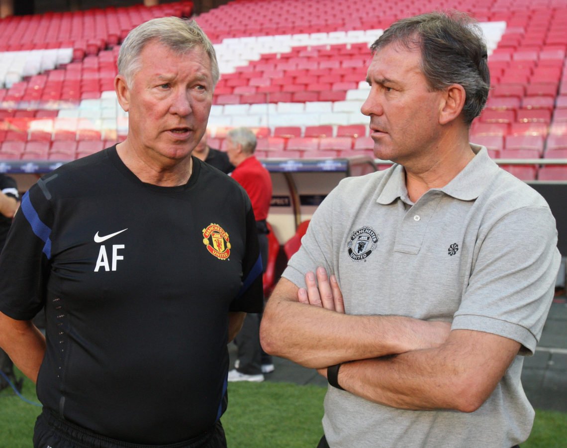 Sir Alex Ferguson (L) and Bryan Robson of Manchester United in action during a first team training session ahead of the UEFA Champions League Group...
