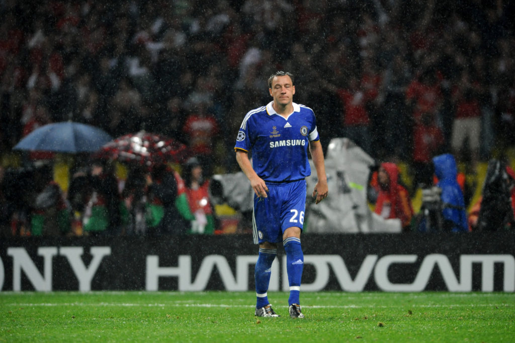 John Terry of Chelsea reacts after missing his penalty during the penalty shootout during the UEFA Champions League final between Manchester United...