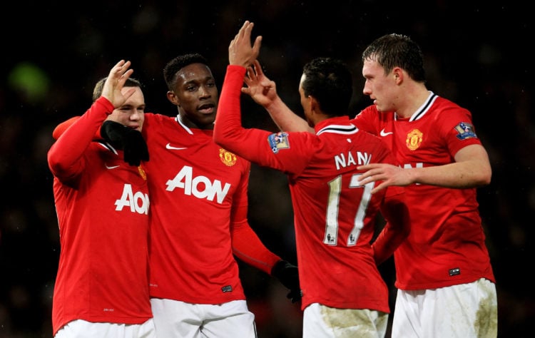 (L-R) Wayne Rooney of Manchester United is congratulated by teammates Danny Welbeck, Nani and Phil Jones after scoring his team's second goal durin...