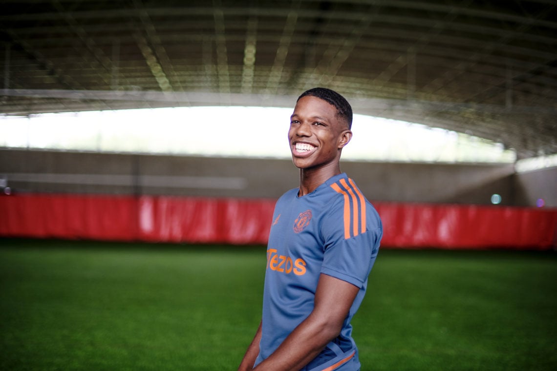 (EXCLUSIVE COVERAGE) Tyrell Malacia of Manchester United poses after signing his contract with the club at Carrington Training Ground on July 05, 2...