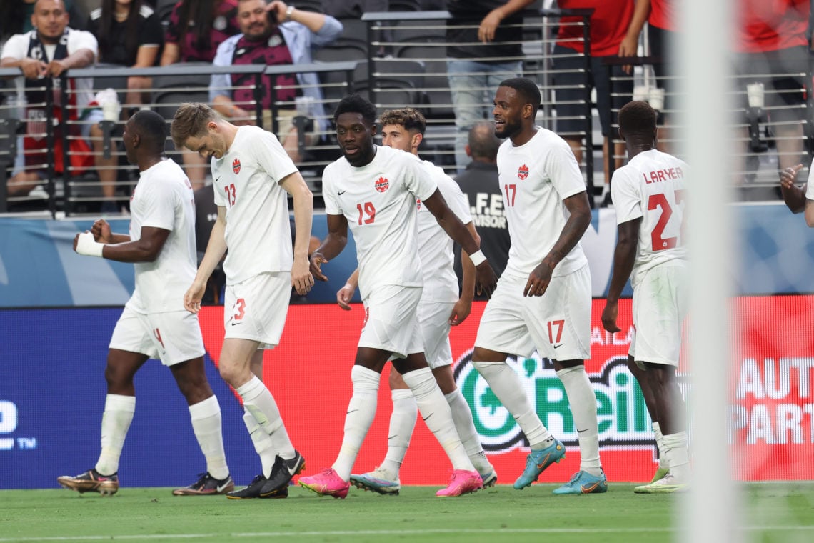 Alphonso Boyle Davies #19 of Canada celebrates with his teammates after scoring their second goal during the match between Panama and Canada as par...