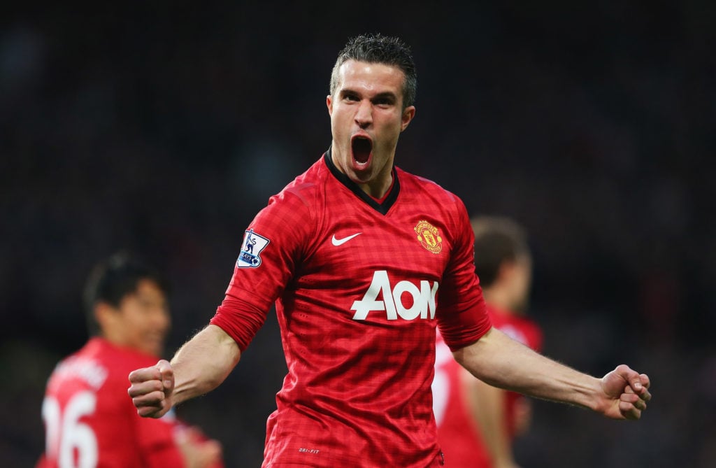 Robin van Persie of Manchester United celebrates scoring the opening goal during the Barclays Premier League match between Manchester United and As...