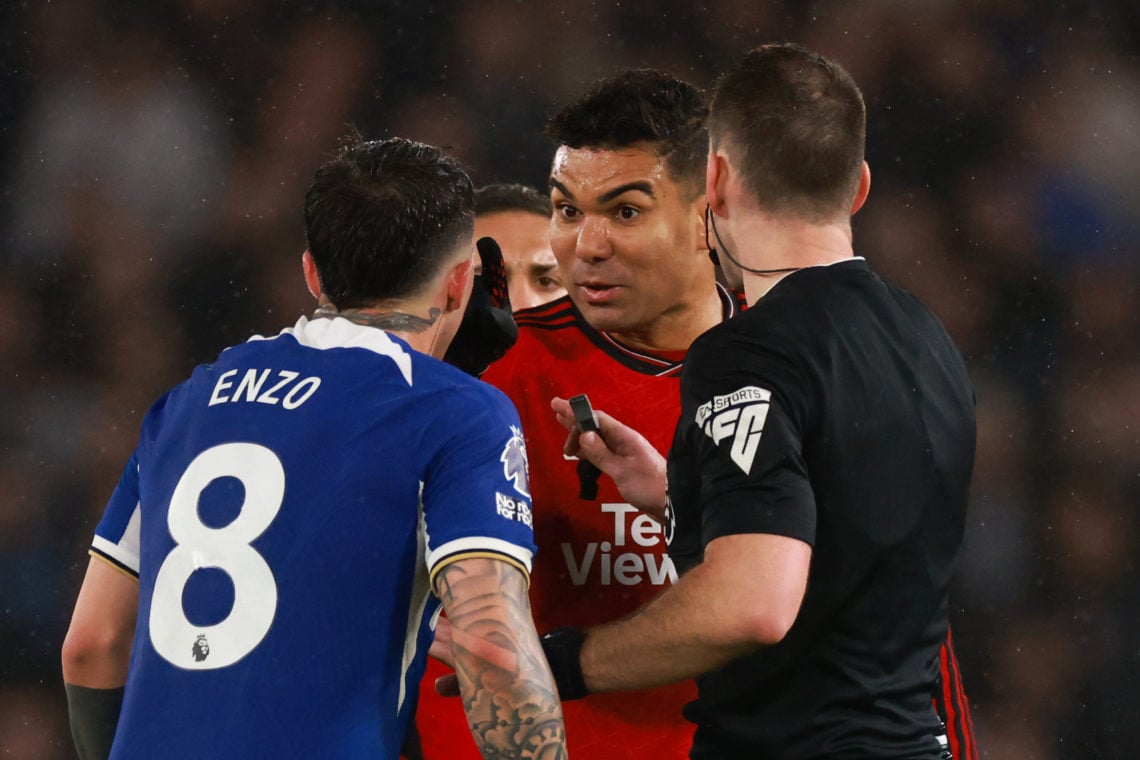 Casemiro of Manchester United argues with Enzo Fernandez of Chelsea during the Premier League match between Chelsea FC and Manchester United at Sta...