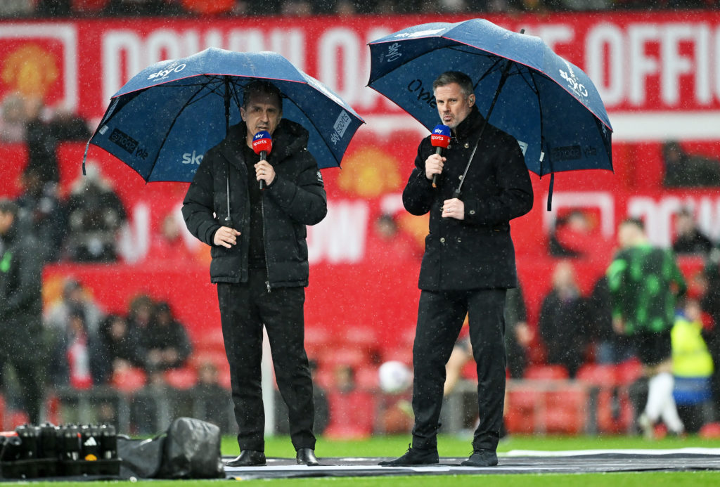 Sky Sports pundits Gary Neville (L) and Jamie Carragher look on prior to the Premier League match between Manchester United and Liverpool FC at Old...