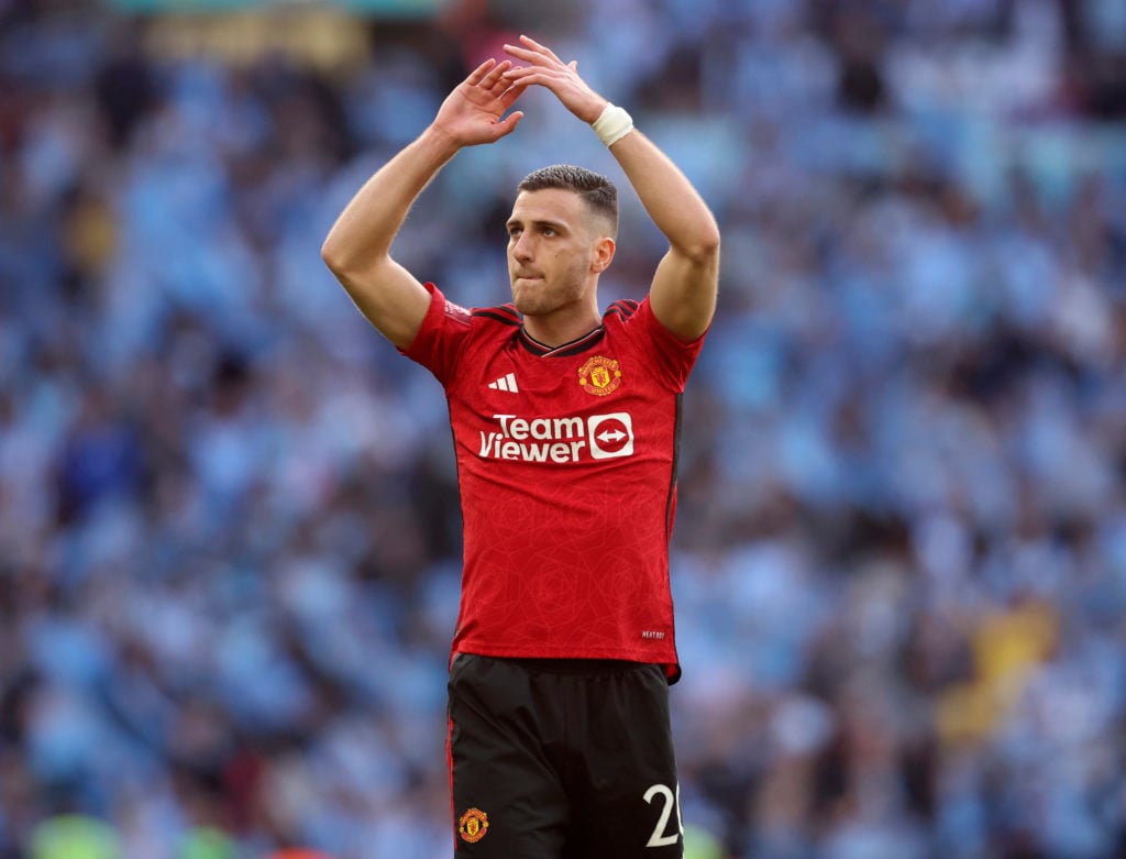 Diogo Dalot of Manchester United applauds the fans after the Emirates FA Cup Semi Final match between Coventry City and Manchester United at Wemble...