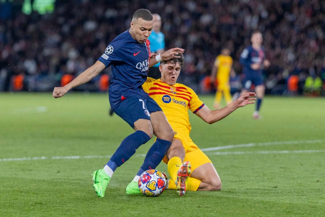Kylian Mbappé #7 of Paris Saint-Germain defended by Pau Cubarsí #33 of Barcelona during the Paris Saint-Germain V Barcelona, UEFA Champions League,...