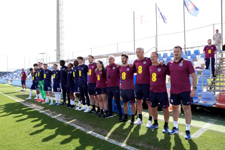 Neil Ryan head coach of England U16 (1st right) lines up with his coaching staff for the national anthems prior to the match between England and It...