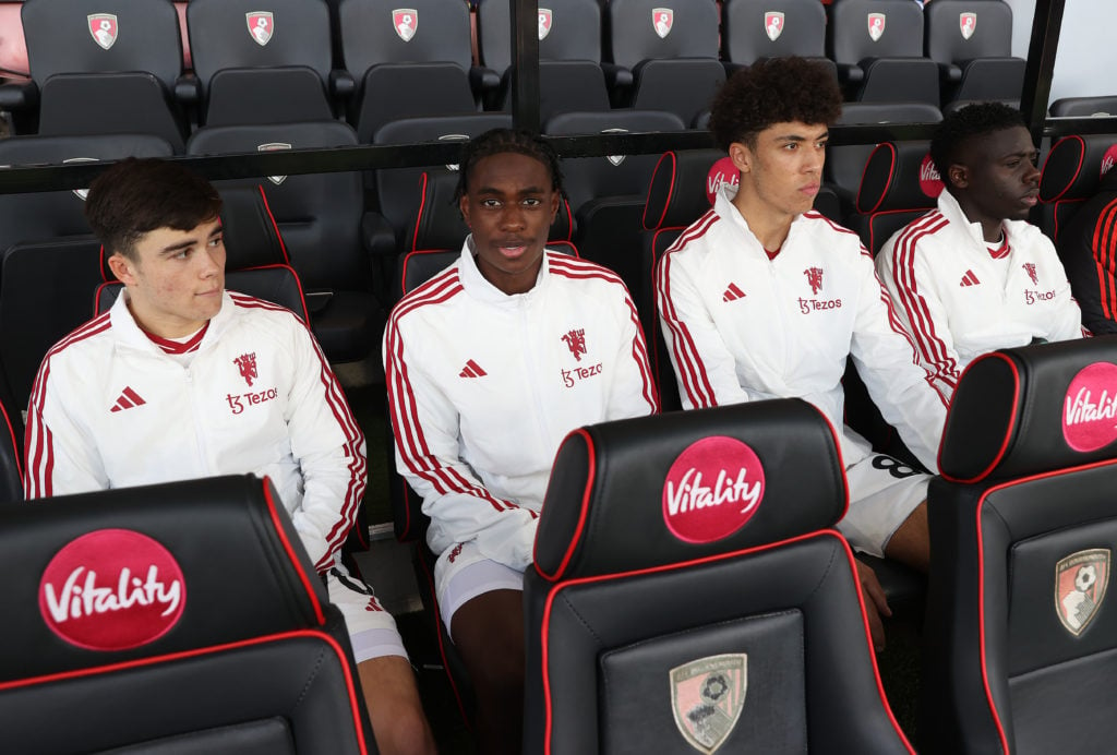 Harry Amass, Habeeb Ogunneye, Ethan Wheatley, Omari Forson of Manchester United sit on the bench ahead of the Premier League match between AFC Bour...