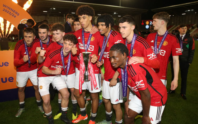 Ethan Wheatley of Manchester United & his team-mates celebrate victory with the trophy at the end of the U18 Premier League Cup Final match bet...