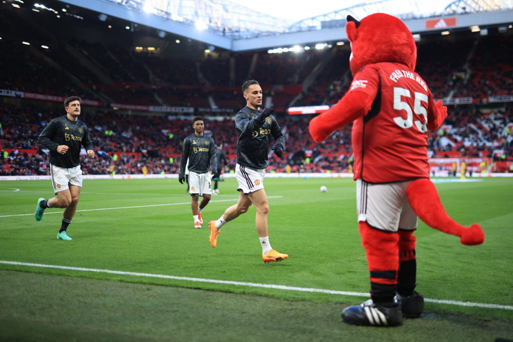 Antony of Manchester United high-fives Manchester United mascot Fred The Red before the Premier League match between Manchester United and Sheffiel...