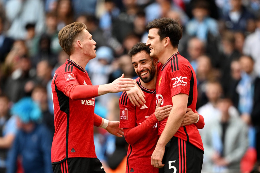 Harry Maguire celebrates with Scott McTominay and Bruno Fernandes of Manchester United after scoring his team's second goal during the Emirates FA ...
