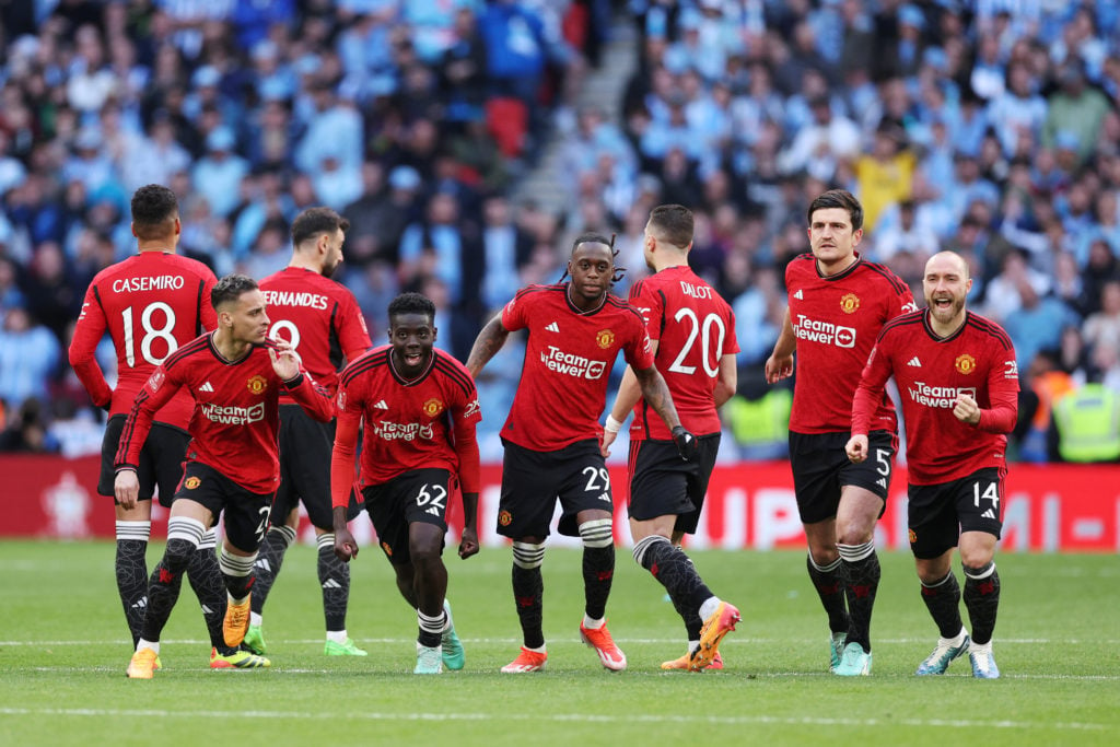 Manchester United players celebrate after the team's victory in the penalty shootout during the Emirates FA Cup Semi Final match between Coventry C...