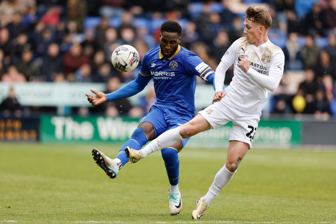 Chey Dunkley of Shrewsbury Town and Ethan Galbraith of Leyton Orient during the Sky Bet League One match between Shrewsbury Town and Leyton Orient ...