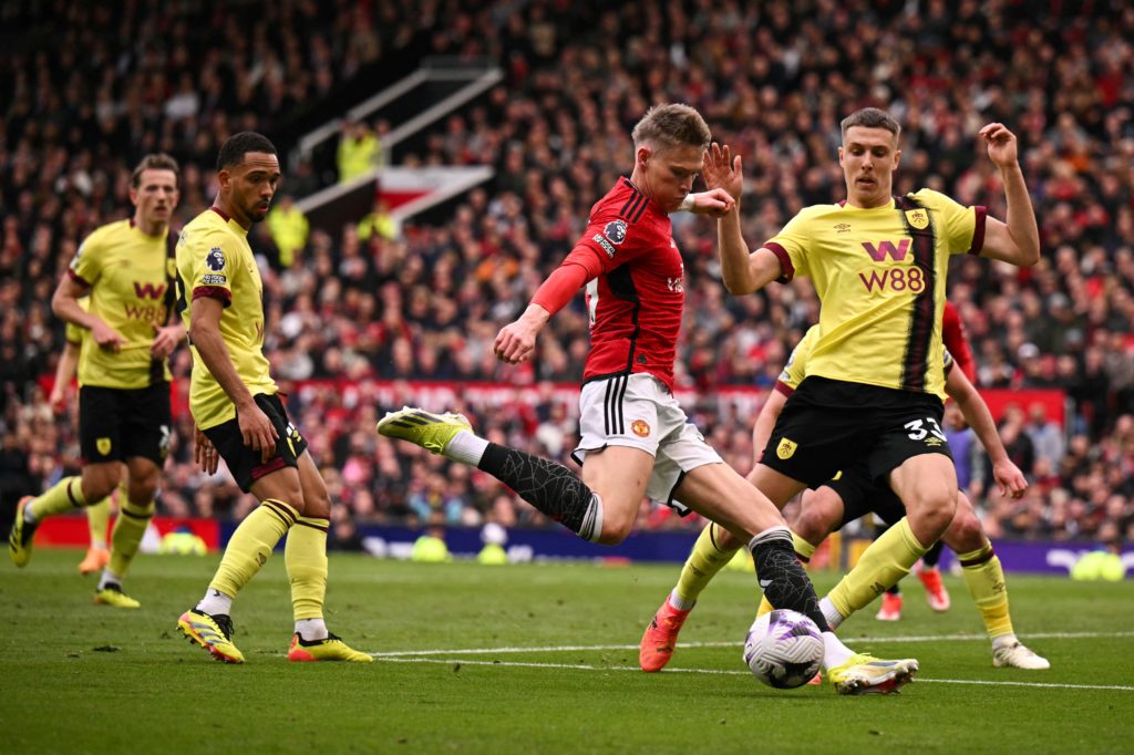 Manchester United's Scottish midfielder #39 Scott McTominay (C) shoots the ball during the English Premier League football match between Manchester...