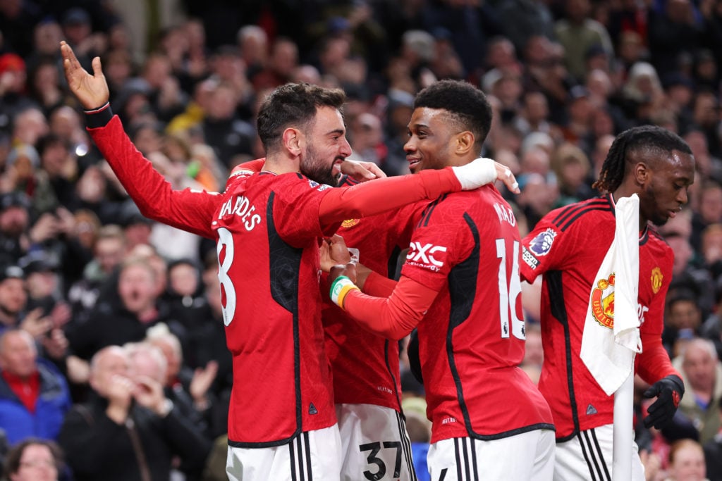 Bruno Fernandes of Manchester United celebrates scoring his team's third goal with Amad Diallo during the Premier League match between Manchester U...