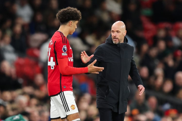 Erik ten Hag, Manager of Manchester United, shows encouragement to Ethan Wheatley of Manchester United before being substituted on for his first te...