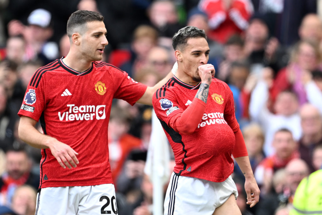 Antony of Manchester United celebrates scoring his team's first goal with teammate Diogo Dalot during the Premier League match between Manchester U...