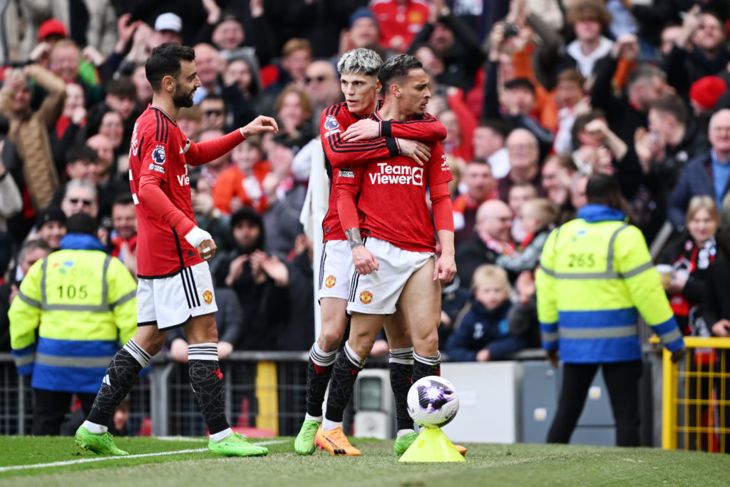 Antony of Manchester United celebrates scoring his team's first goal with teammates Alejandro Garnacho and Bruno Fernandes during the Premier Leagu...