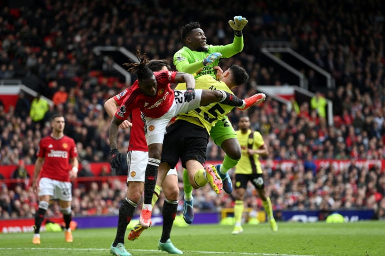 Manchester United goalkeeper André Onana fouls Zeki Amdouni of Burnley to concede a penalty kick during the Premier League match between Manchester...