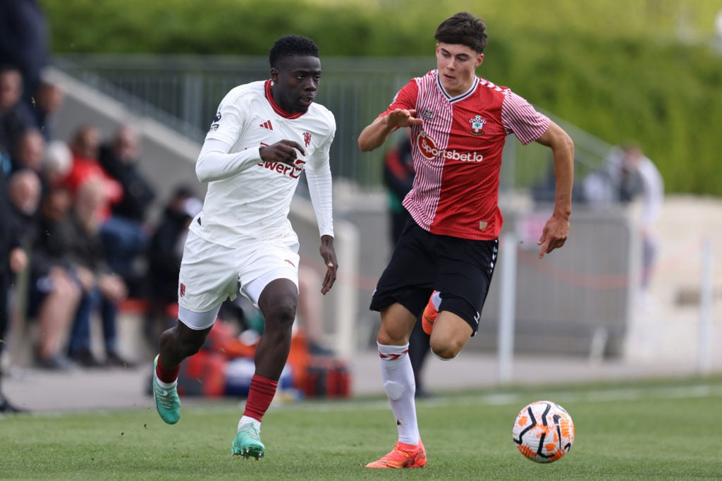 Omari Forson of Manchester United U21s looks to get past Southampton U21s Jay Robinson during the Premier League 2 match between Southampton U21 an...