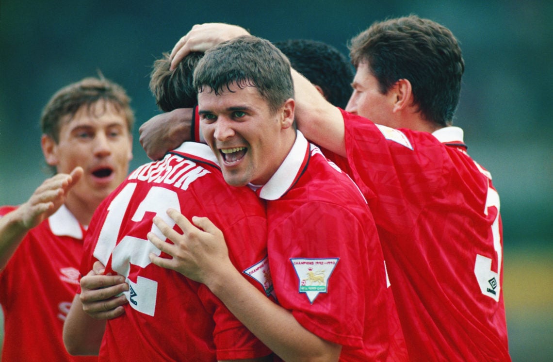 Manchester United player Roy Keane (c) celebrates a goal by Bryan Robson (12) with team mates during a Premier League match between Norwich City an...