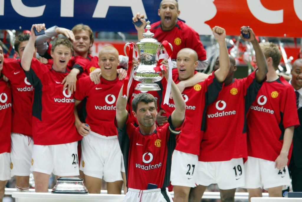 Manchester United's captain Roy Keane lifts the FA Cup after his team's FA Cup Final victory over Millwall 22 May, 2004 in Cardiff, Wales. Manchest...