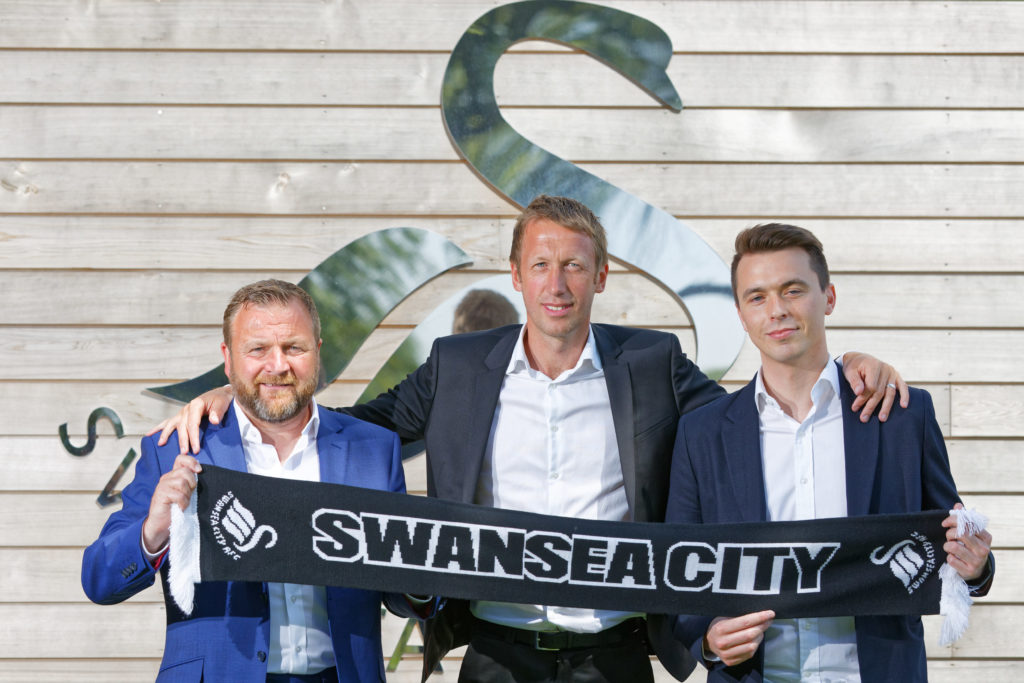 (L-R) Billy Reid, Graham Potter and Kyle Macaulay during the unveiling of the new manager Graham Potter at The Fairwood Training Ground on June 11,...