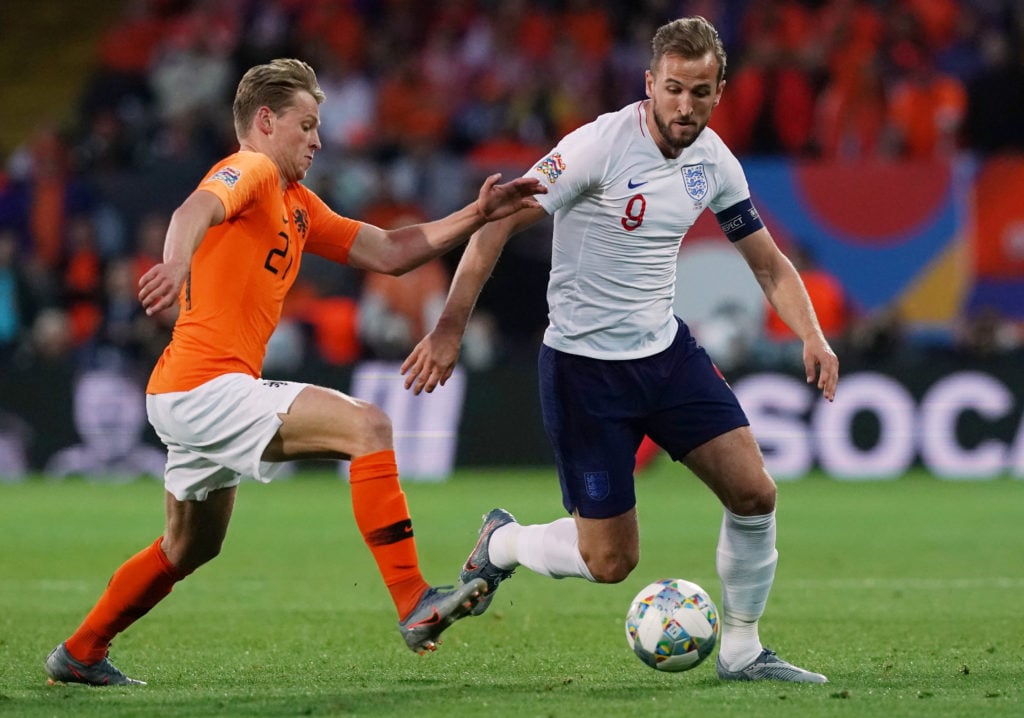 Harry Kane of England and Tottenham Hotspur FC with Frenkie de Jong of Netherlands and Ajax in action during the UEFA Nations League Semi-Final mat...