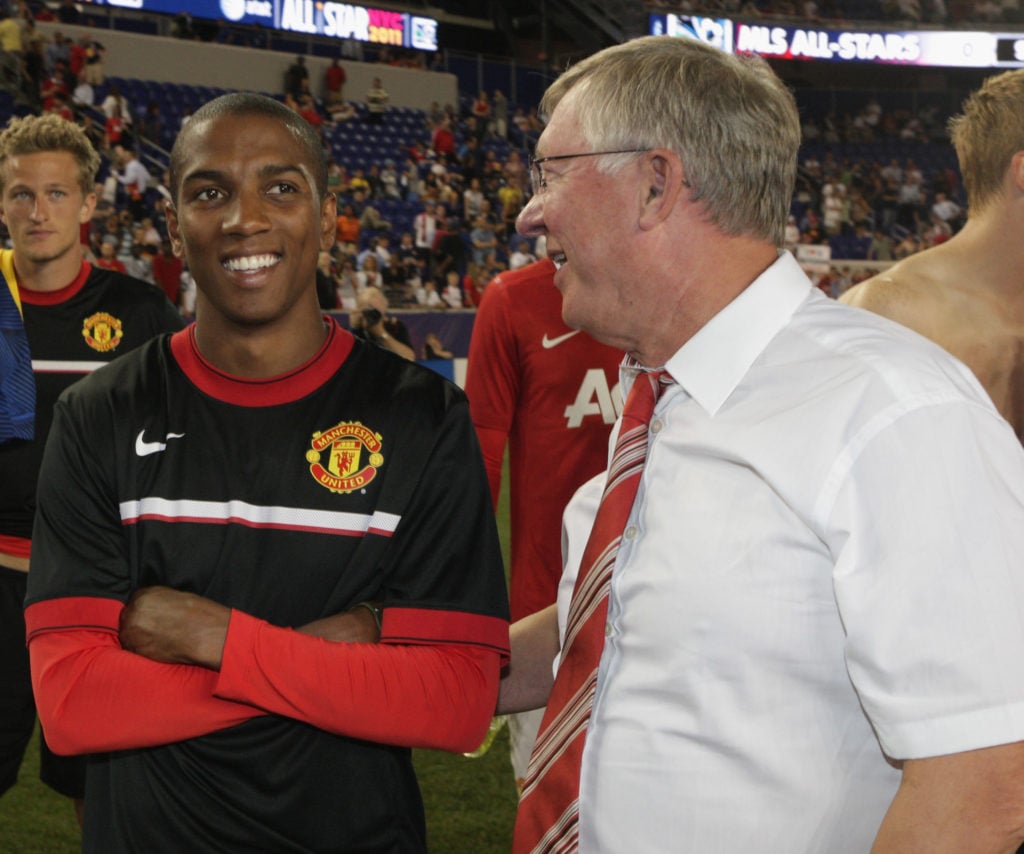 Sir Alex Ferguson (R) of Manchester United talks to Ashley Young after the MLS All Star match between MLS All Stars and Manchester United at Red Bu...
