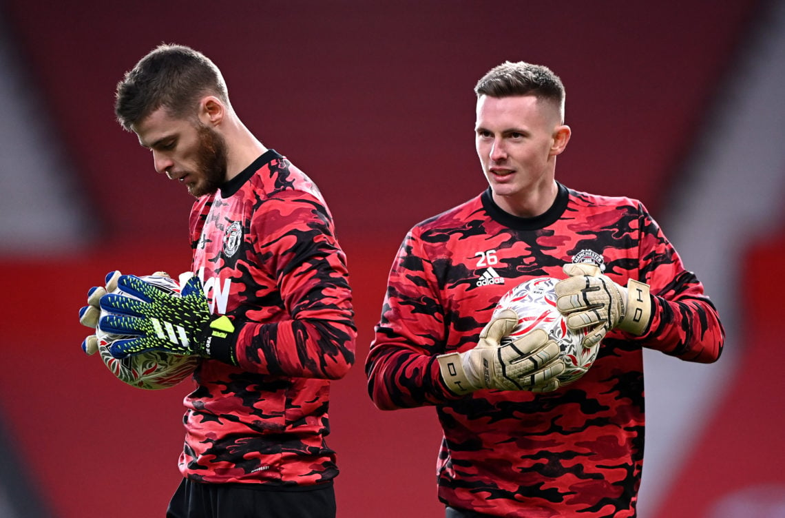 Dean Henderson of Manchester United warms up with team mate David De Gea (L) ahead of The Emirates FA Cup Fourth Round match between Manchester Uni...