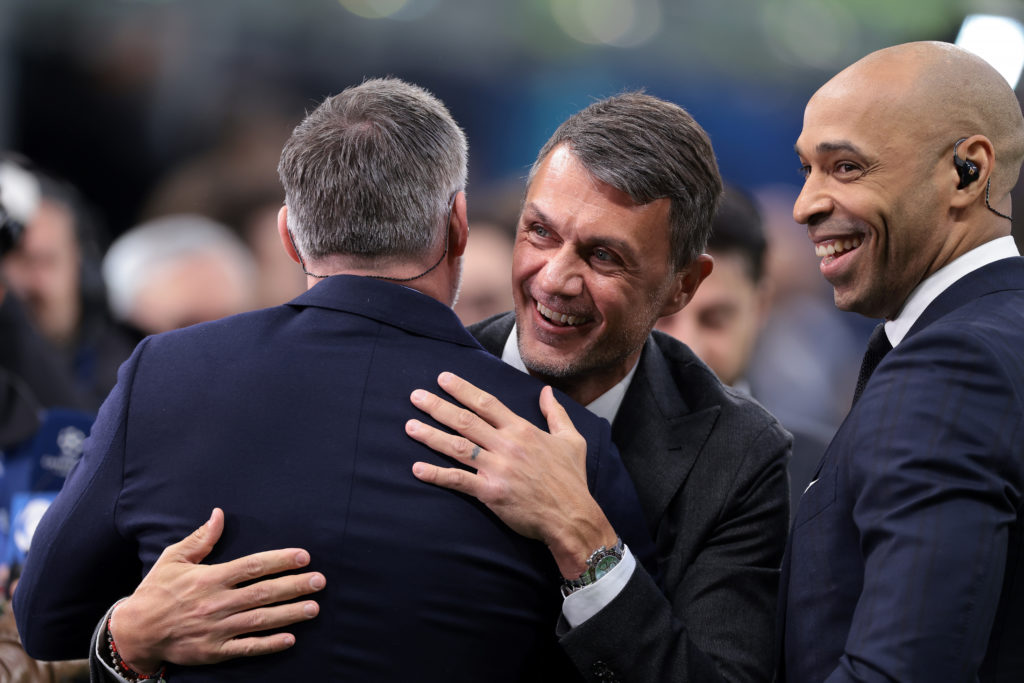Paolo Maldini AC Milan First Team Technical Director salutes Former footballers Theirry Henry and Janie Carragher as they comment on the touchline ...