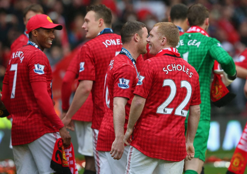 Paul Scholes of Manchester United performs a lap of honour with his team-mates following the Barclays Premier League match between Manchester Unite...