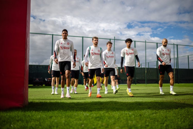 Raphael Varane, Mason Mount, Louis Jackson, Ethan Williams and Sofyan Amrabat of Manchester United in action during a first team training session a...